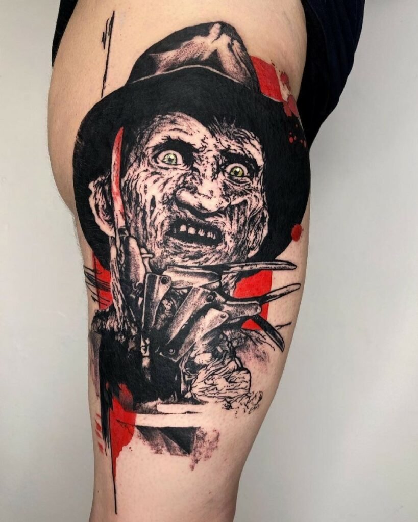 Artista: MircoCampioni. Pro Team Artist Water Law Tattoo. Tatuaggio realistico di Freddy Krueger in bianco e nero su sfondo rosso.